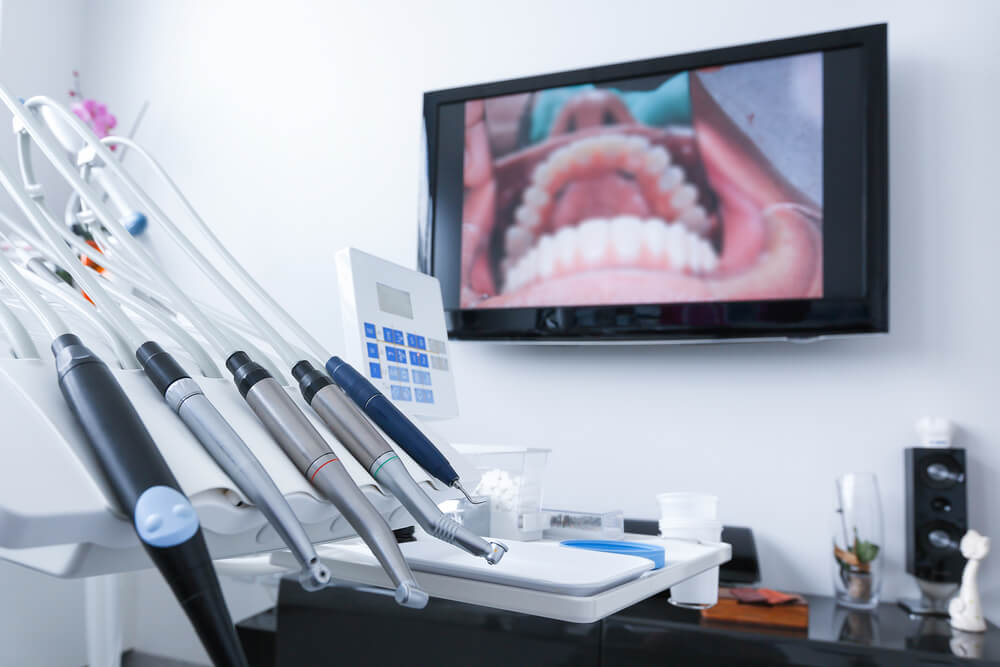 Dental office - specialist tools, drills, handpieces and laser with live picture of teeth